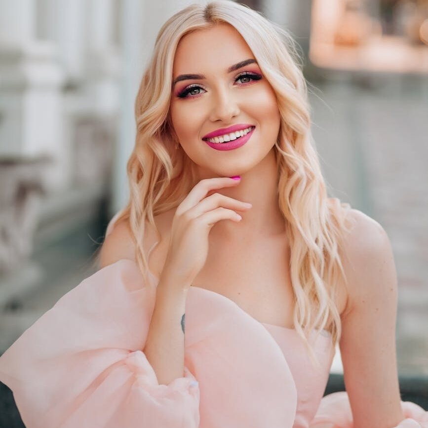 how to start your healing era a beautiful blonde woman in a pink dress women's personal development SK Lumen